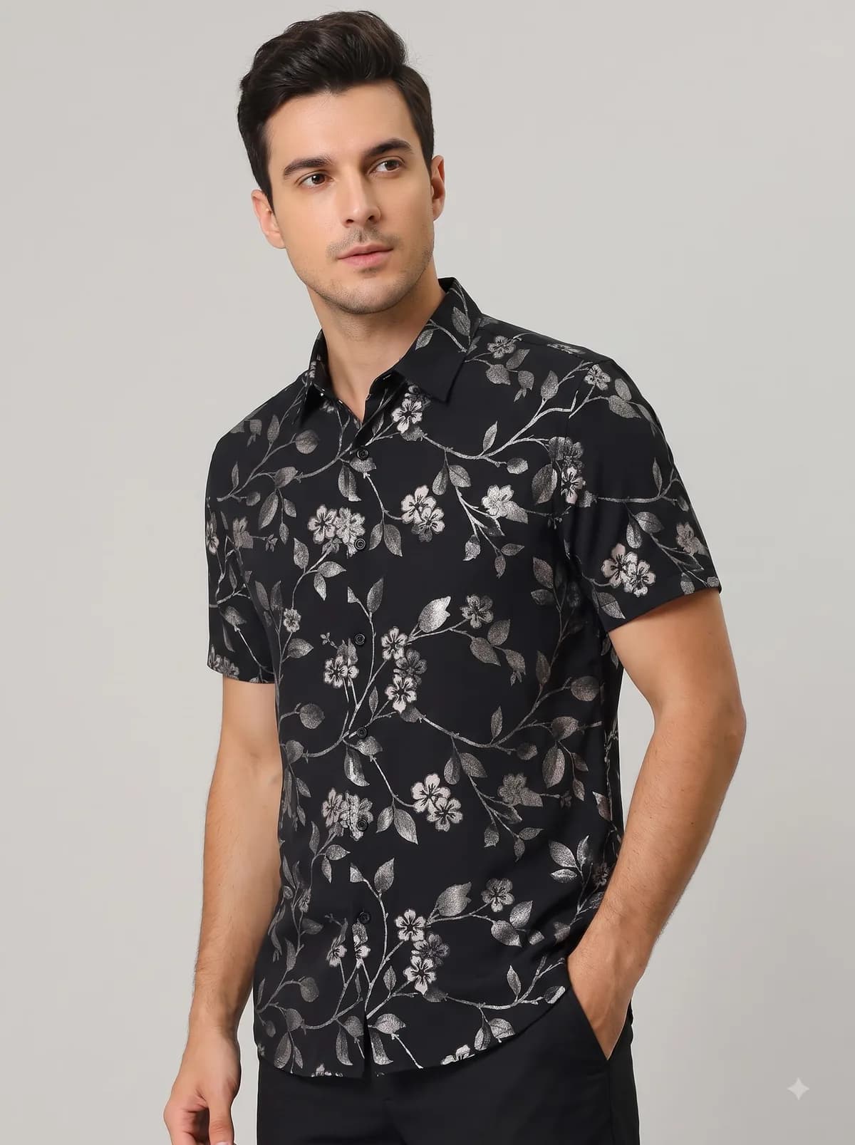 Model in a black half-sleeve shirt with a silver climbing vine floral print