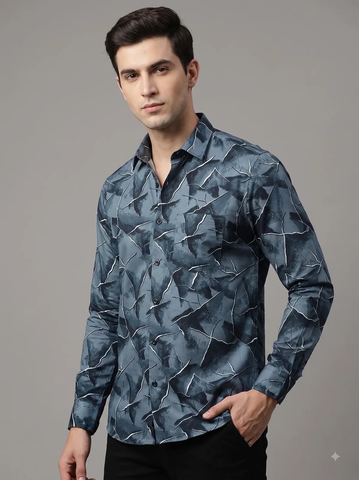 Model in a slate blue full-sleeve shirt with a fractured marble print
