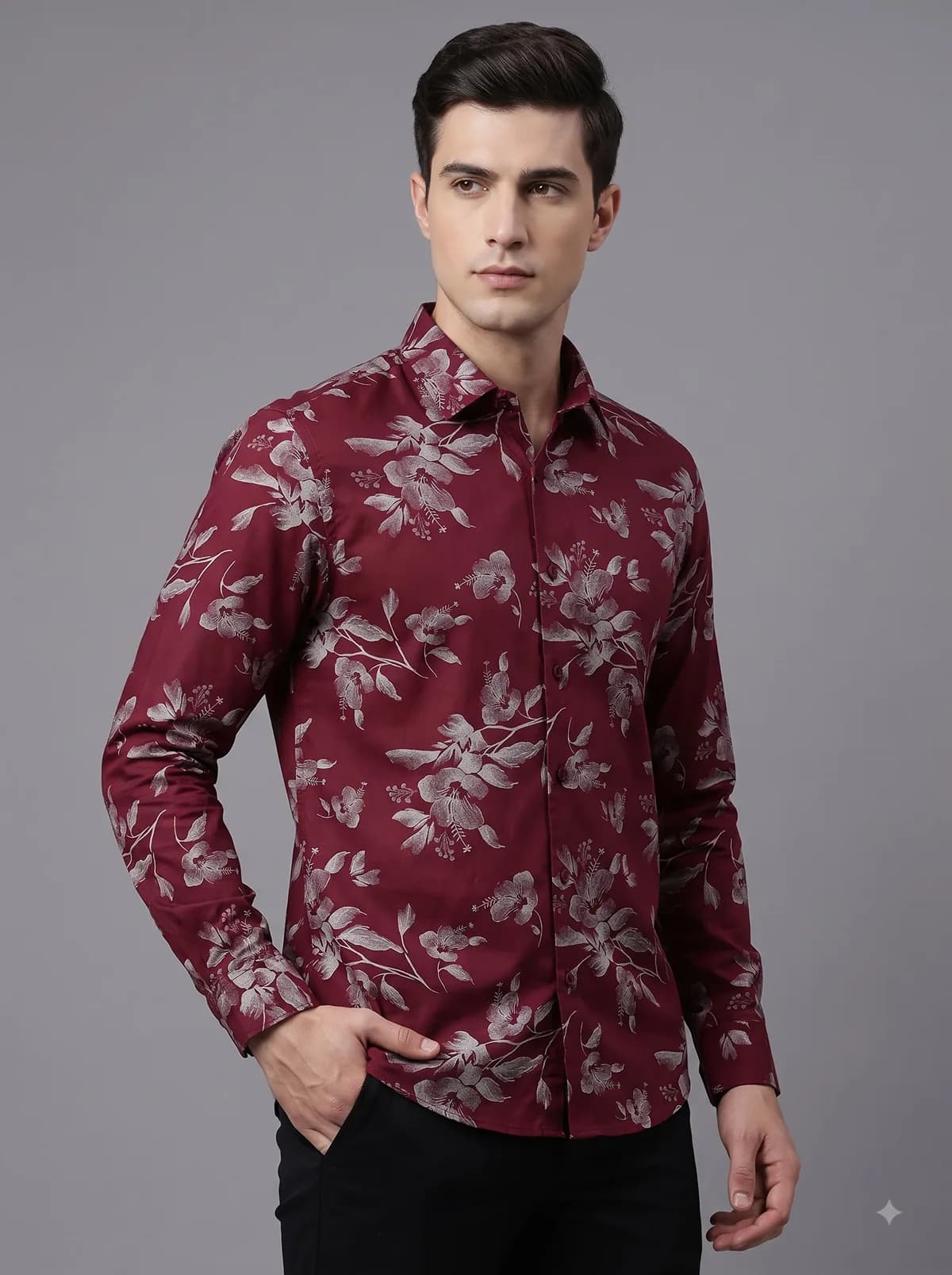 Model in a burgundy full-sleeve shirt with a silver hibiscus print